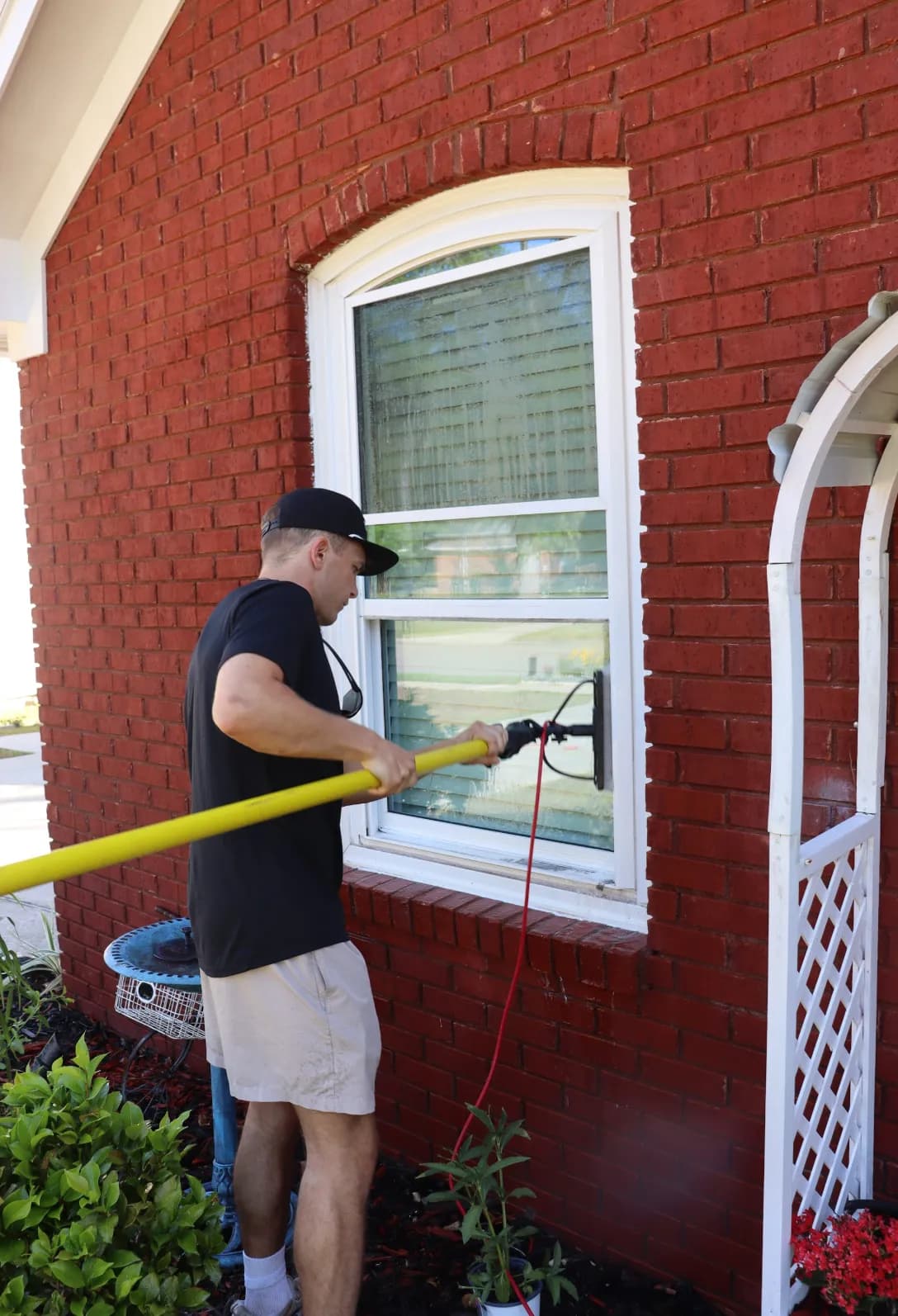 Professional exterior window cleaning on a brick home in Tallahassee