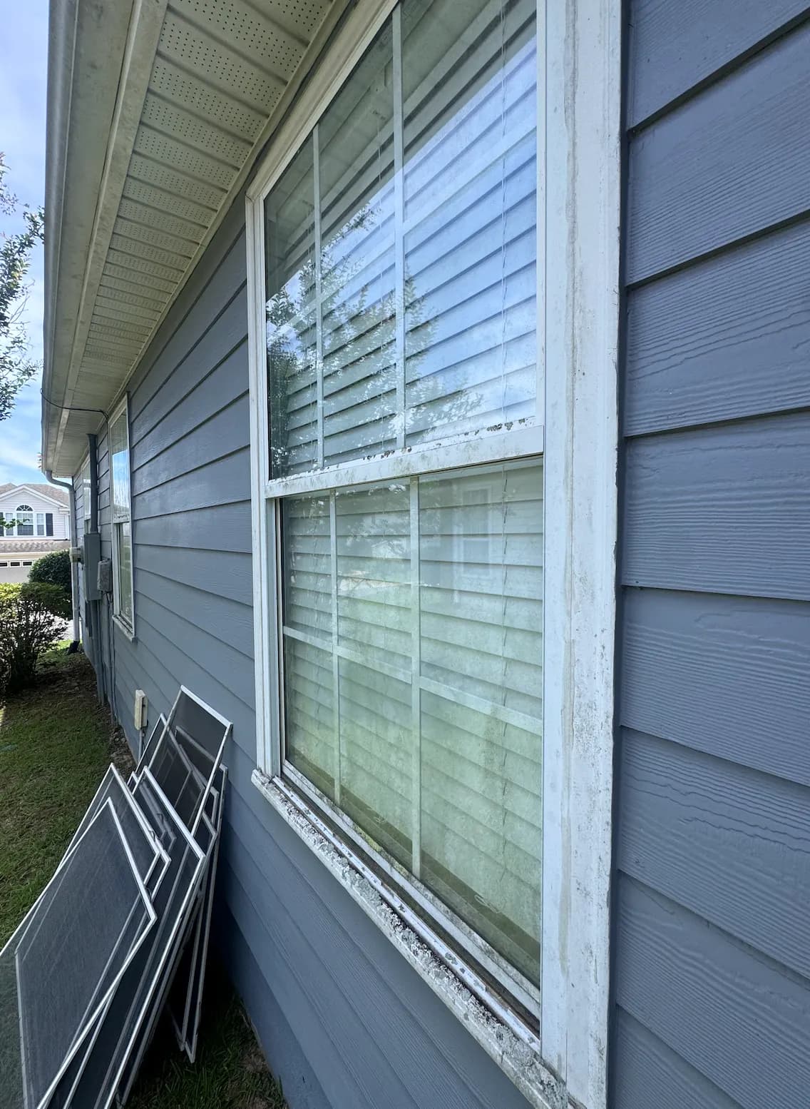 Residential window in Tallahassee — before cleaning